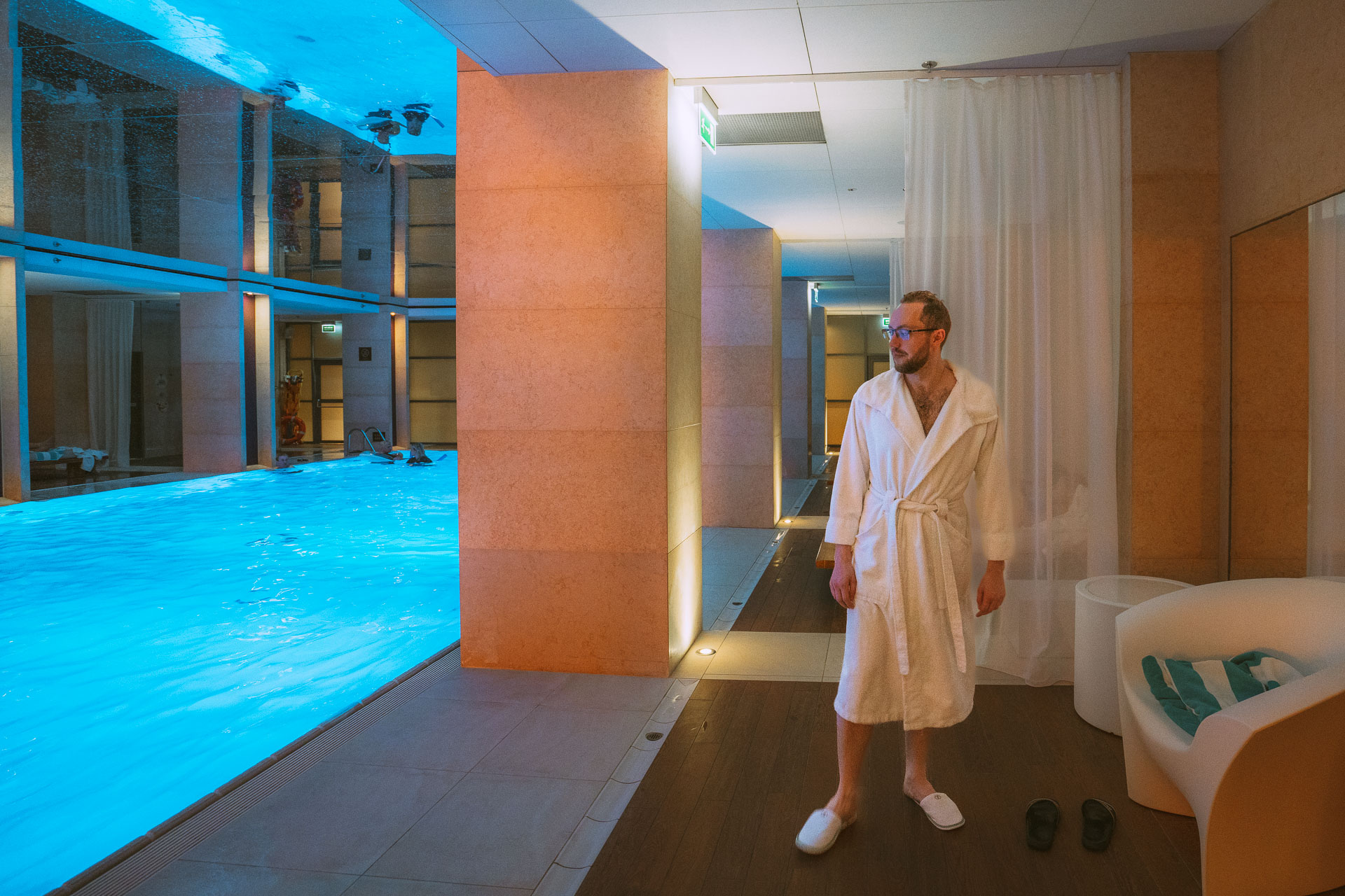 Poland Insiders photographer Andrzej is looking at the pool inside Sofitel hotel in Warsaw